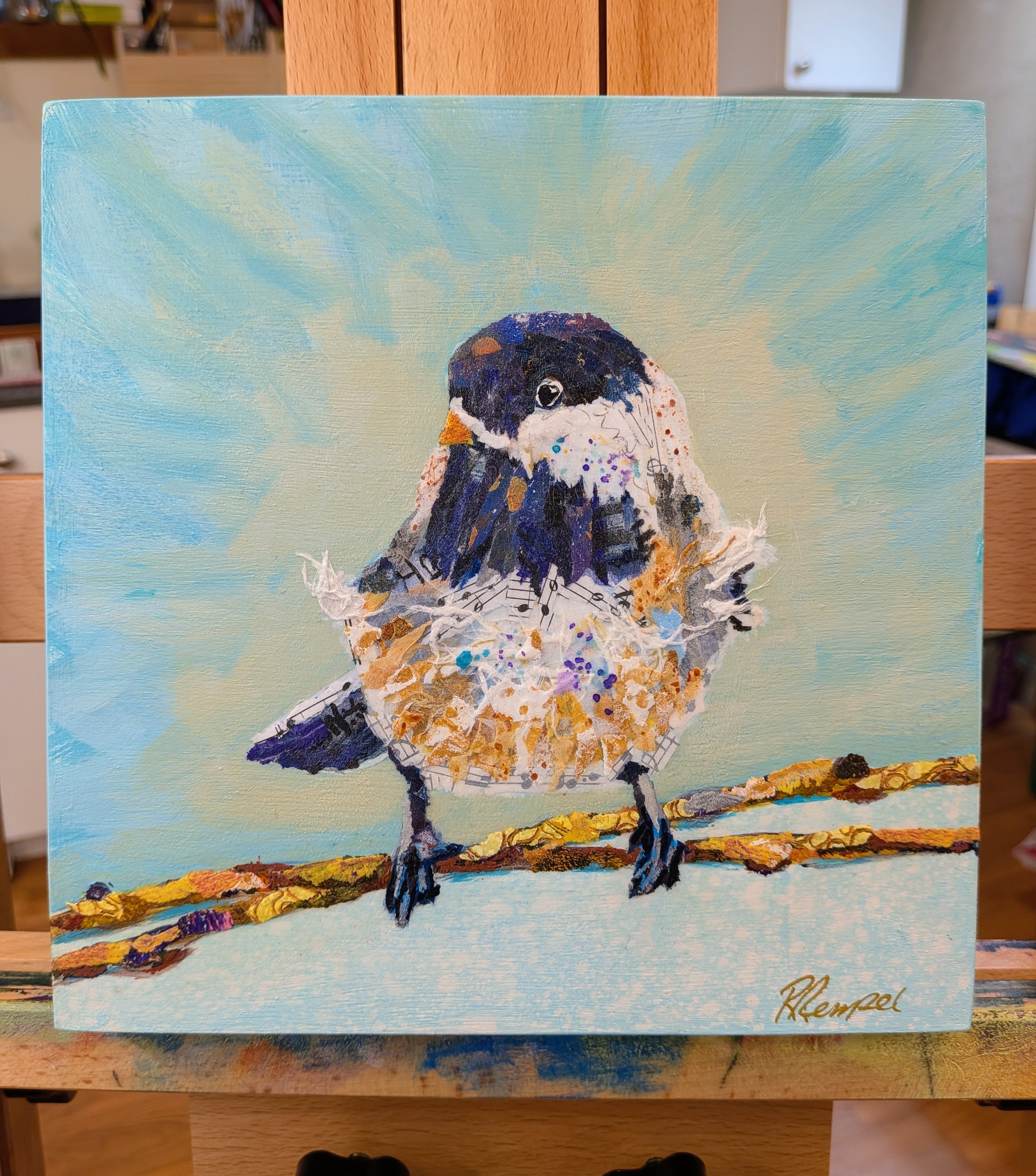 Small songbird with speckled belly perched on a patterned branch